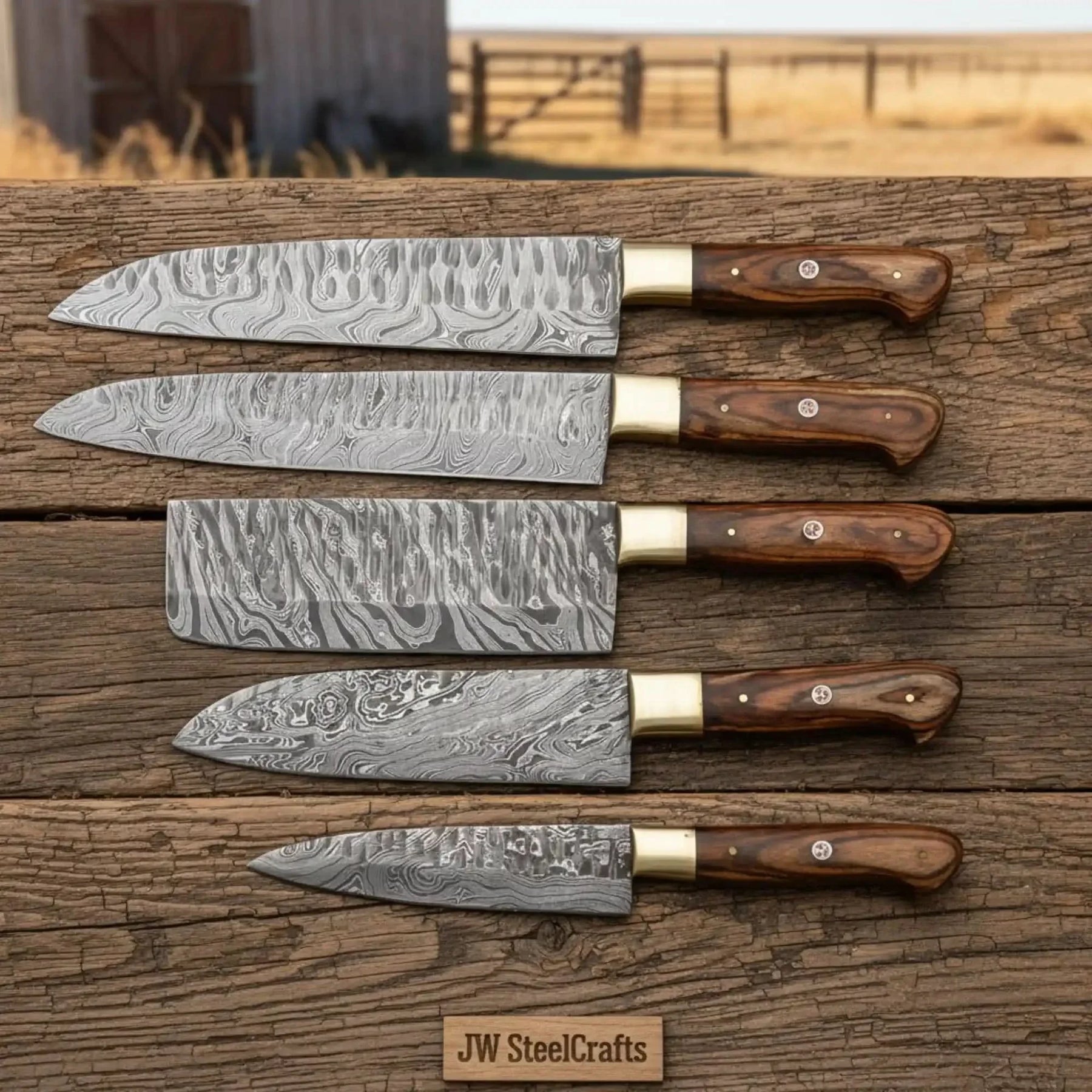 Handmade damascus steel knife with wood handle on dark surface