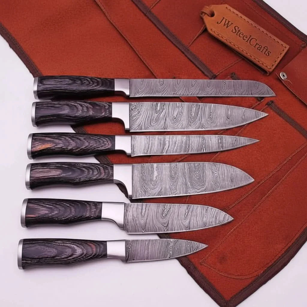 Handmade damascus steel knife with wood handle on dark surface