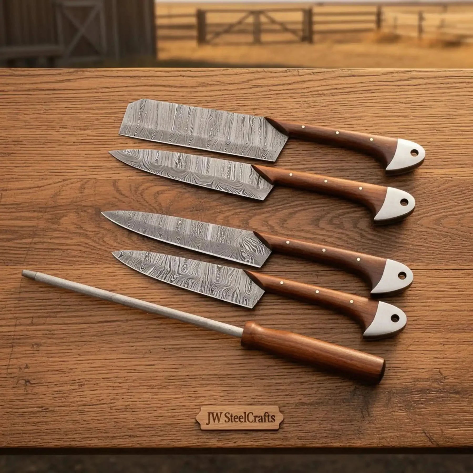 Handmade damascus steel knife with premium handle on dark surface