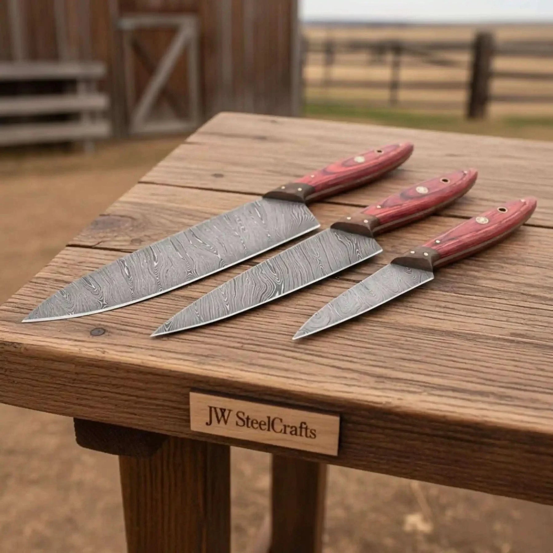 Handmade damascus steel knife with premium handle on dark surface