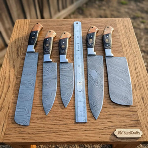 Handmade damascus steel knife with wood handle on dark surface