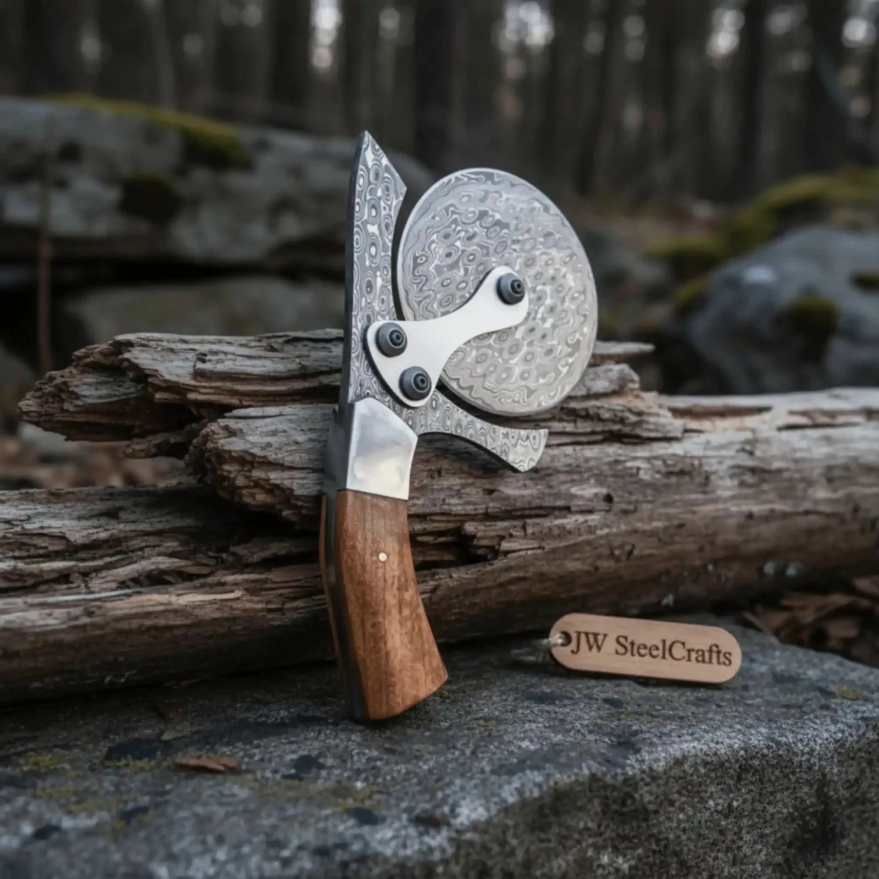 Handmade damascus steel knife with wood handle on dark surface