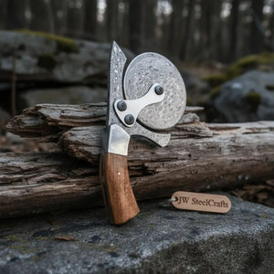 Handmade damascus steel knife with wood handle on dark surface