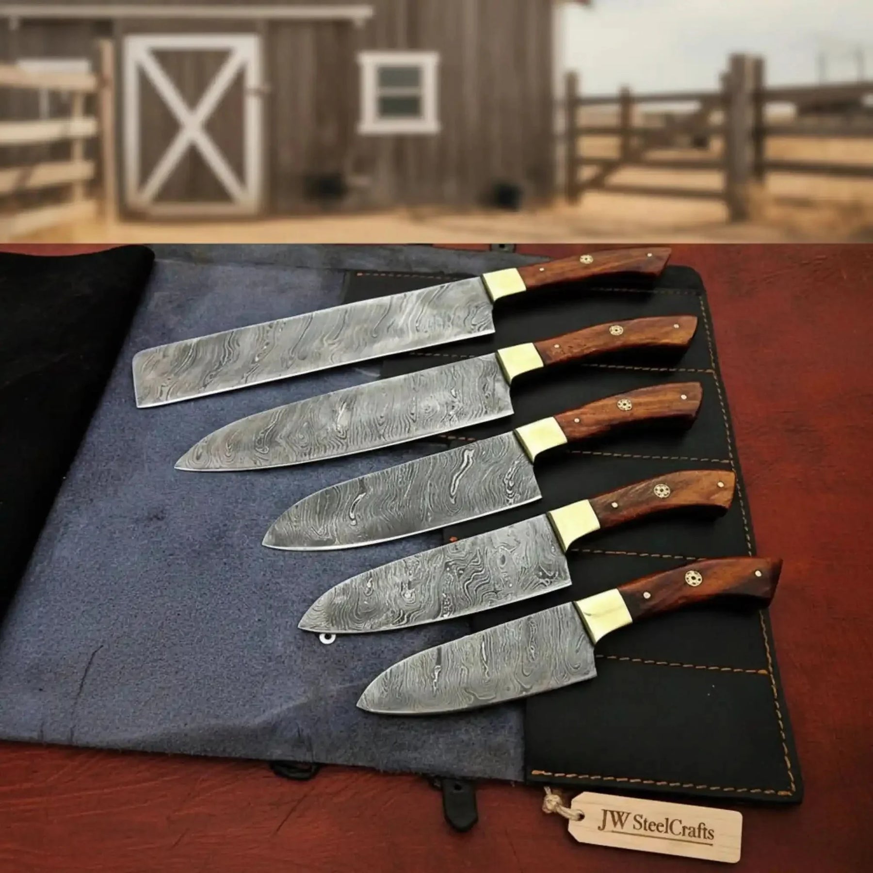 Handmade damascus steel knife with wood handle on dark surface