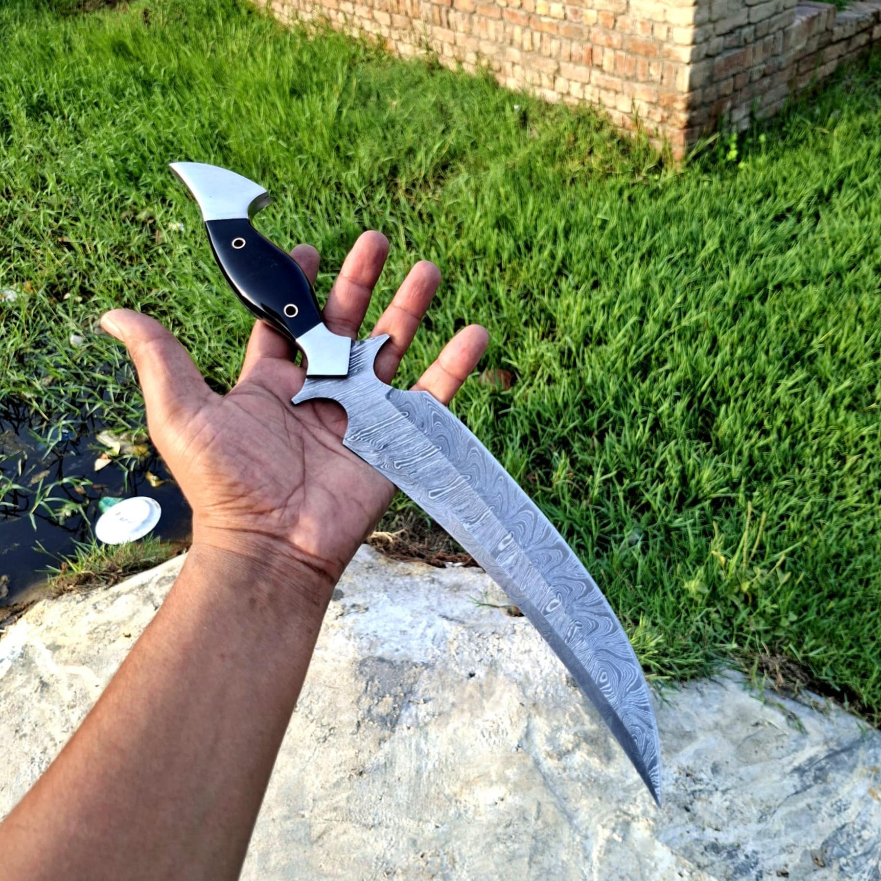 Hooked Guard Skinner Dagger with Black Handle and Long Patterned Blade