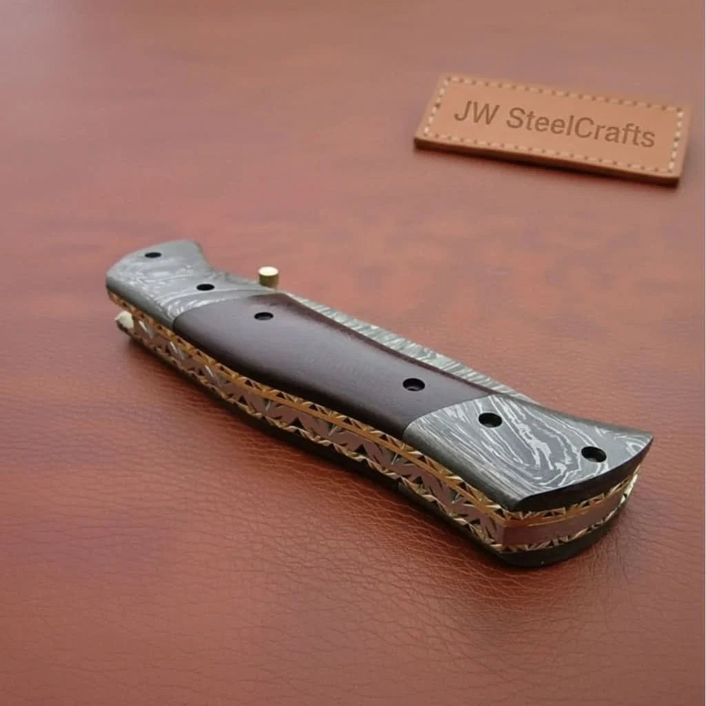 Handmade Damascus Steel Folding Knife – Matte Black Handle with Brass Liner & Thumb Stud | JW SteelCrafts by JW SteelCrafts, Damascus knife detail photo 2