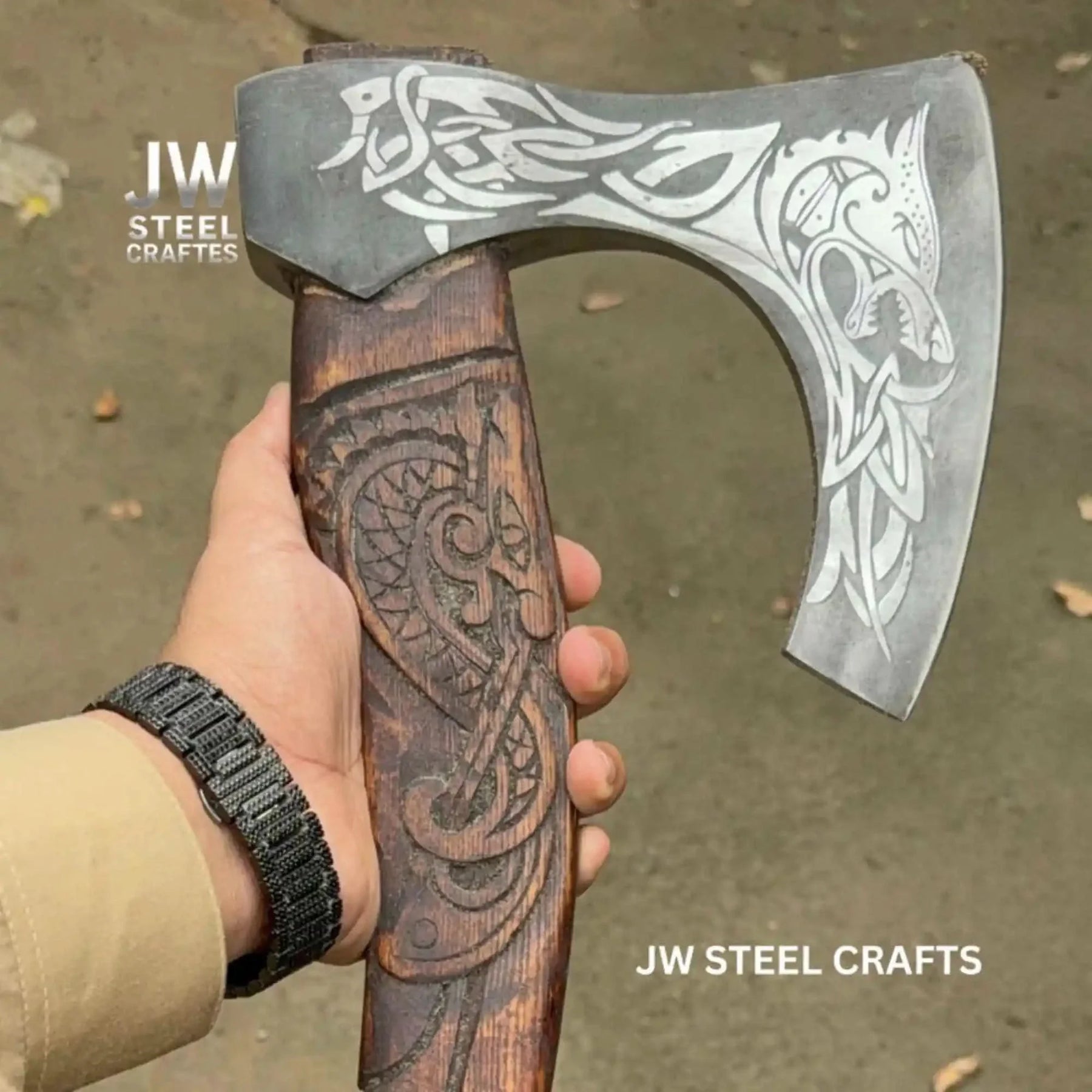Damascus steel axe head with wood handle on rustic wood surface