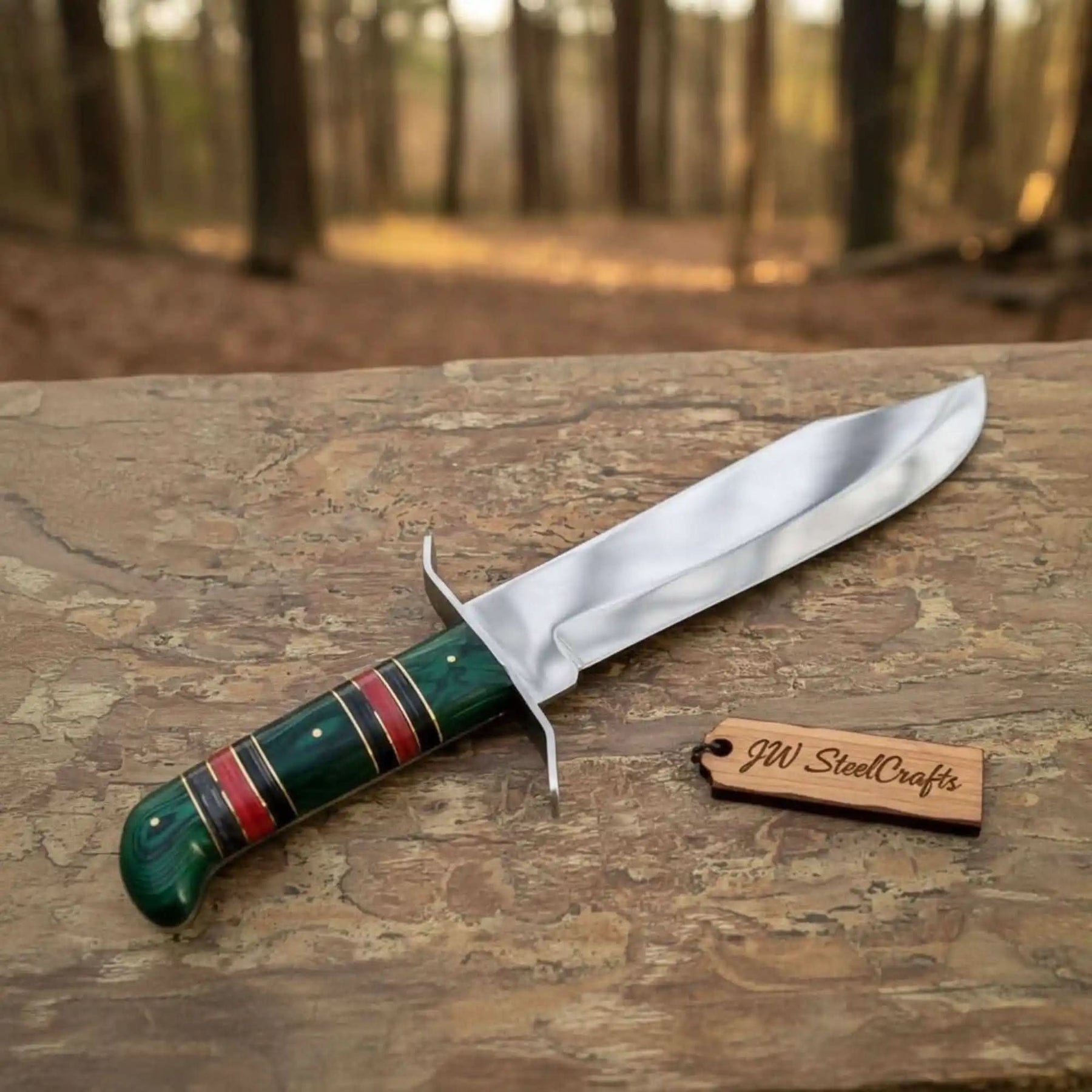 Handmade carbon steel steel knife with wood handle on dark surface