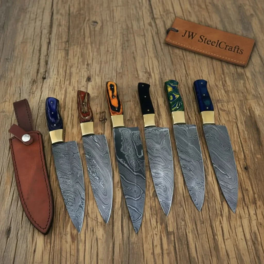 Handmade damascus steel knife with resin handle on dark surface