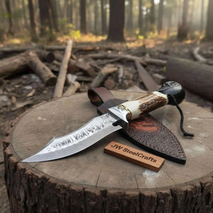 Handmade damascus steel knife with leather handle on dark surface
