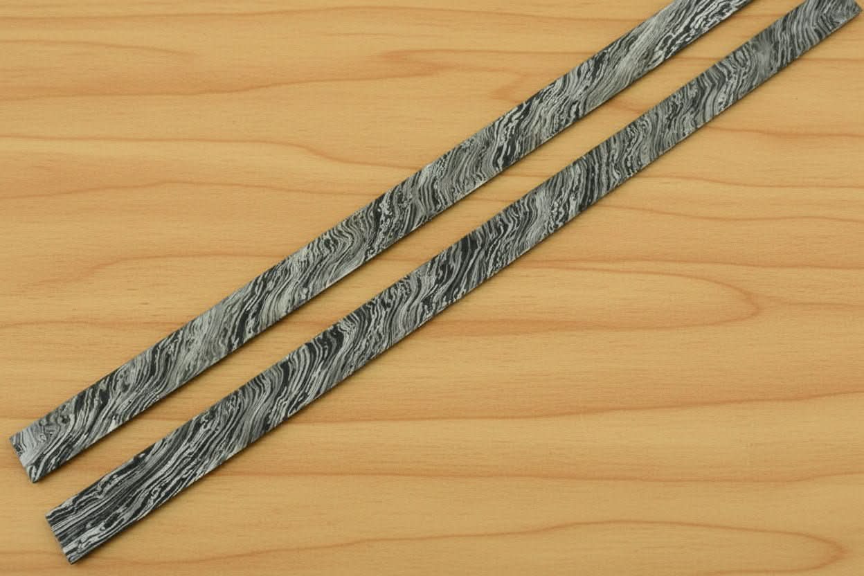 Handmade damascus steel knife with premium handle on dark surface