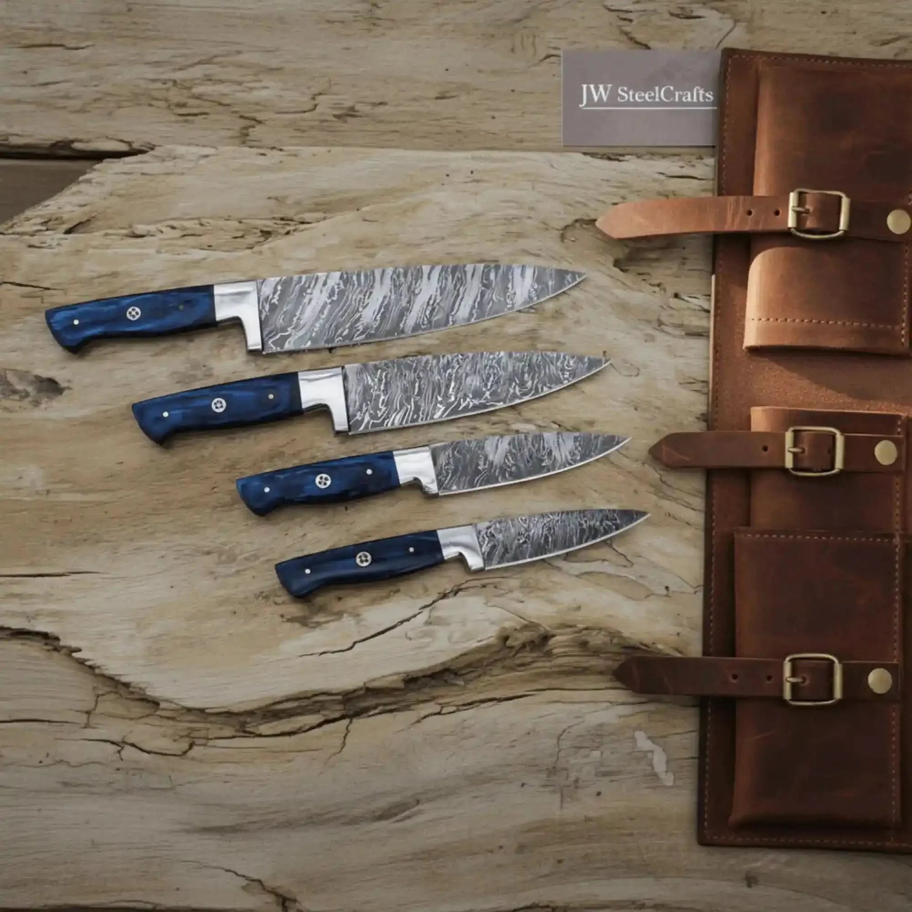 Handmade damascus steel knife with wood handle on dark surface