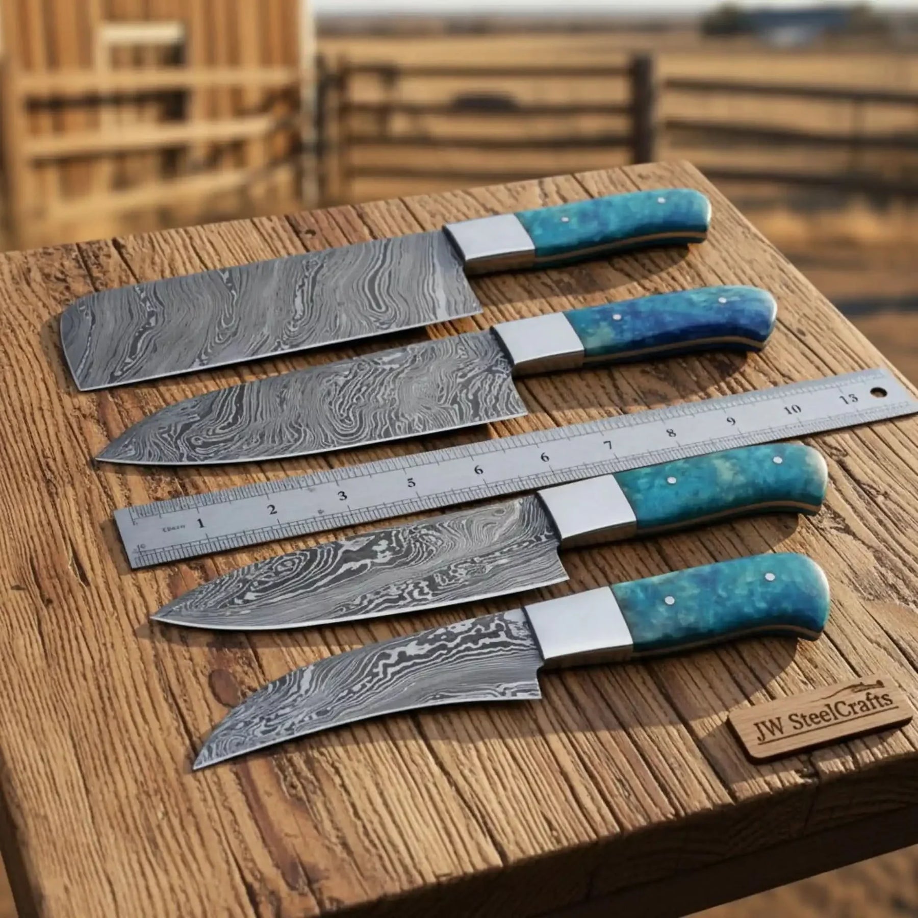 Handmade damascus steel knife with resin handle on dark surface