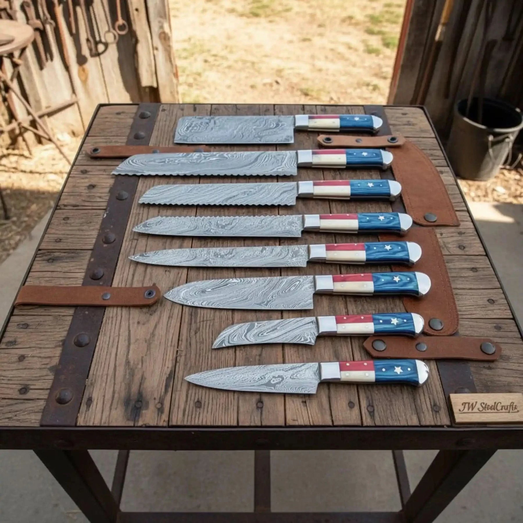Handmade damascus steel knife with premium handle on dark surface