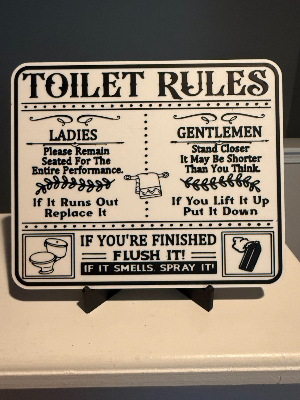 Black and white funny toilet rules bathroom sign