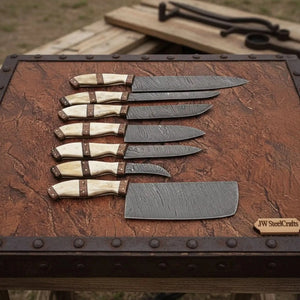 Handmade damascus steel knife with premium handle on dark surface