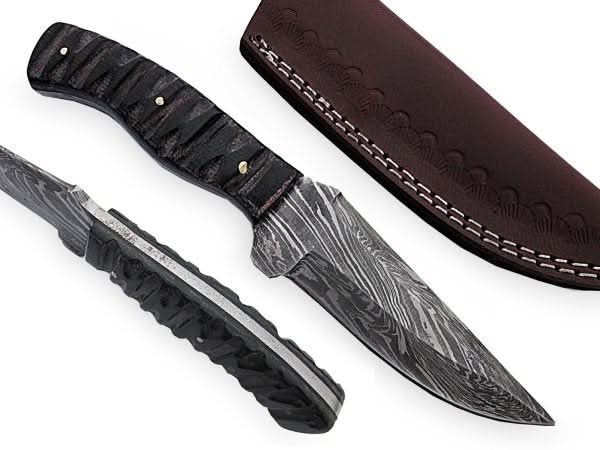 Handmade damascus steel knife with premium handle on dark surface