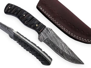 Handmade damascus steel knife with premium handle on dark surface