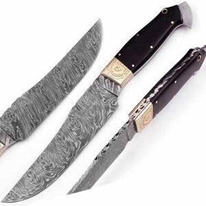 Handmade damascus steel knife with premium handle on dark surface