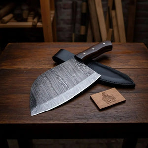 Handmade damascus steel knife with wood handle on dark surface