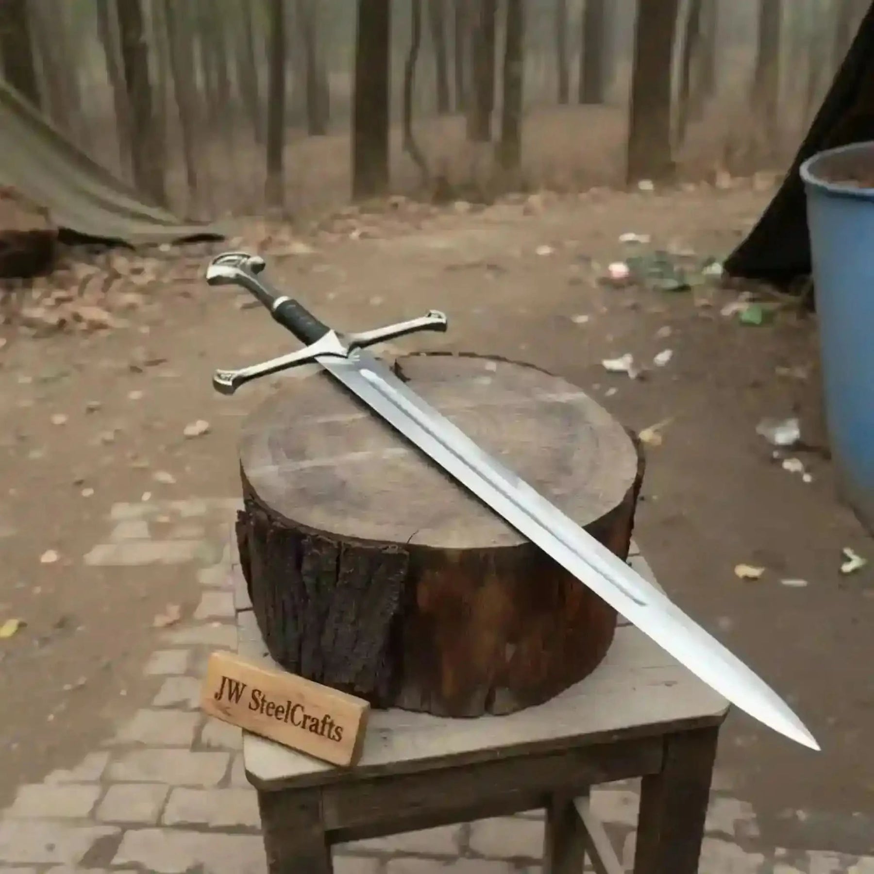 Full-length damascus steel replica sword with premium handle on dark background