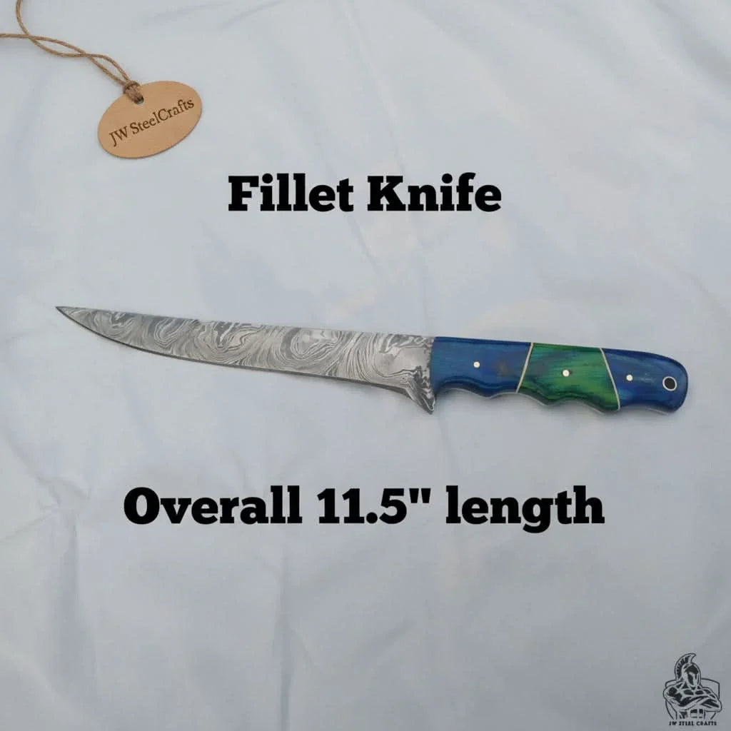 Handmade damascus steel knife with wood handle on dark surface