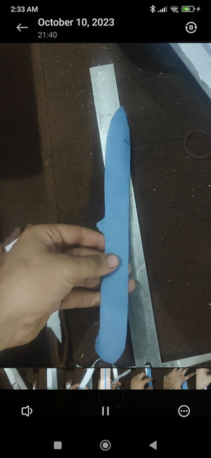Handmade damascus steel knife with leather handle on dark surface