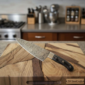 Handmade damascus steel knife with premium handle on dark surface