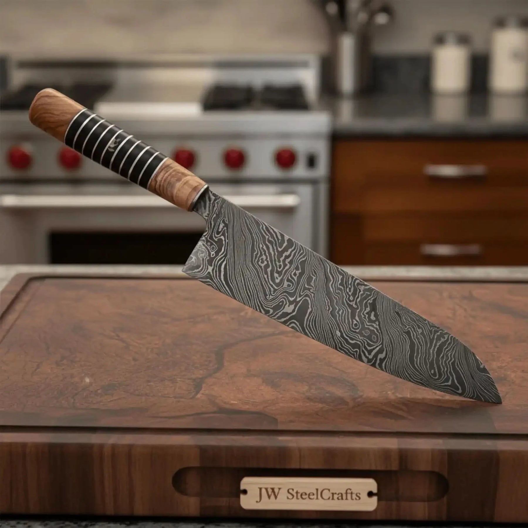Handmade damascus steel knife with wood handle on dark surface
