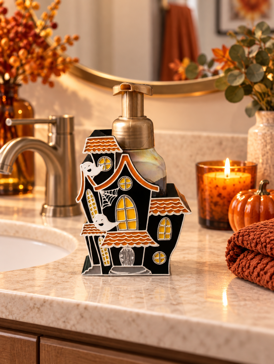 Haunted house Halloween soap dispenser holder styled on a bathroom vanity