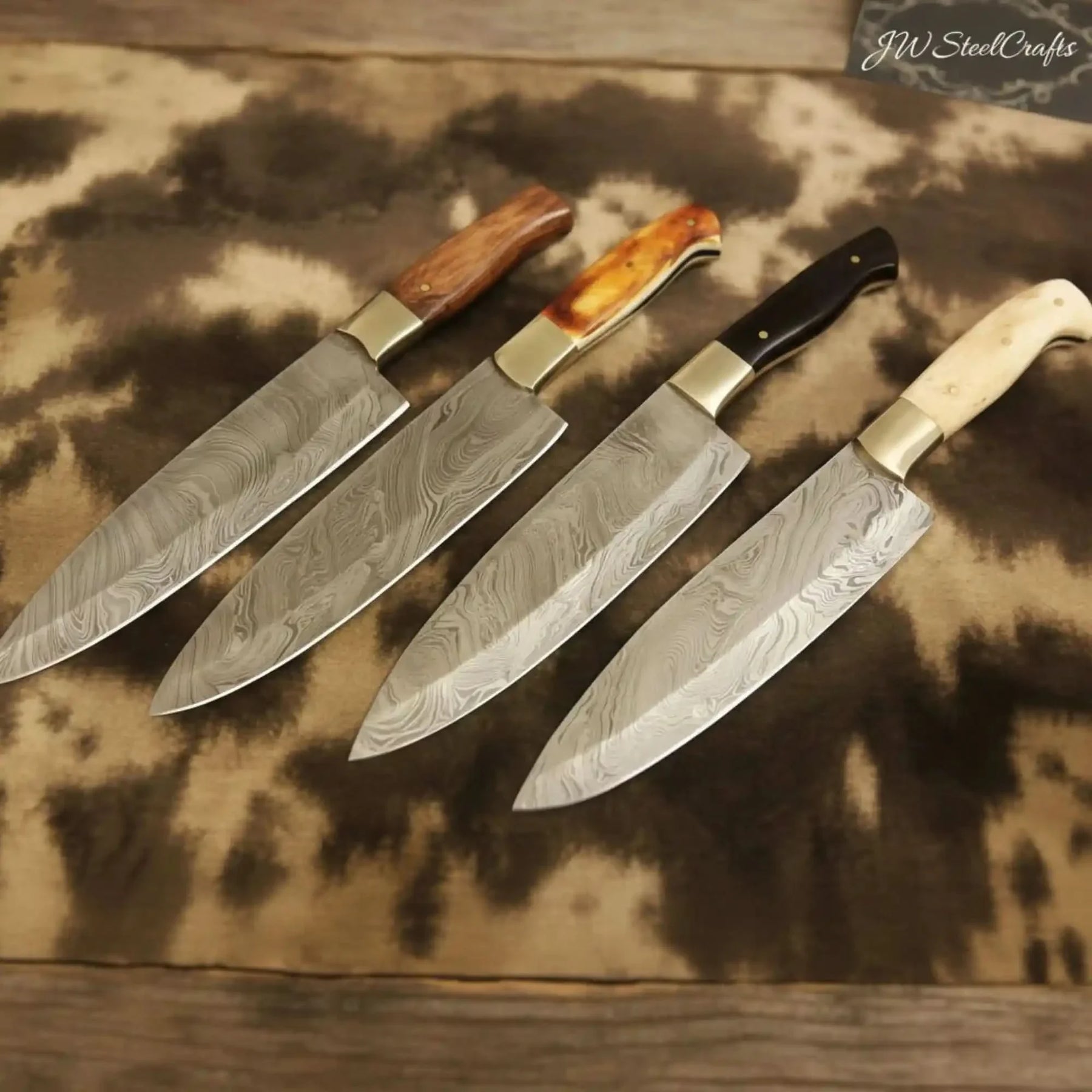 Handmade damascus steel knife with premium handle on dark surface