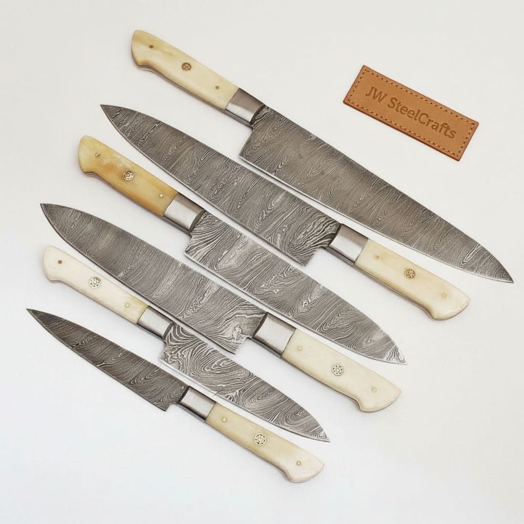 Handmade damascus steel knife with bone handle on dark surface