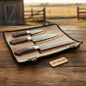Handmade damascus steel knife with wood handle on dark surface