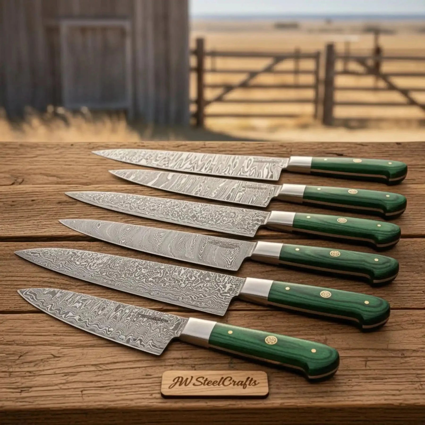 Handmade damascus steel knife with premium handle on dark surface