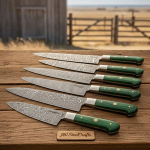 Handmade damascus steel knife with premium handle on dark surface