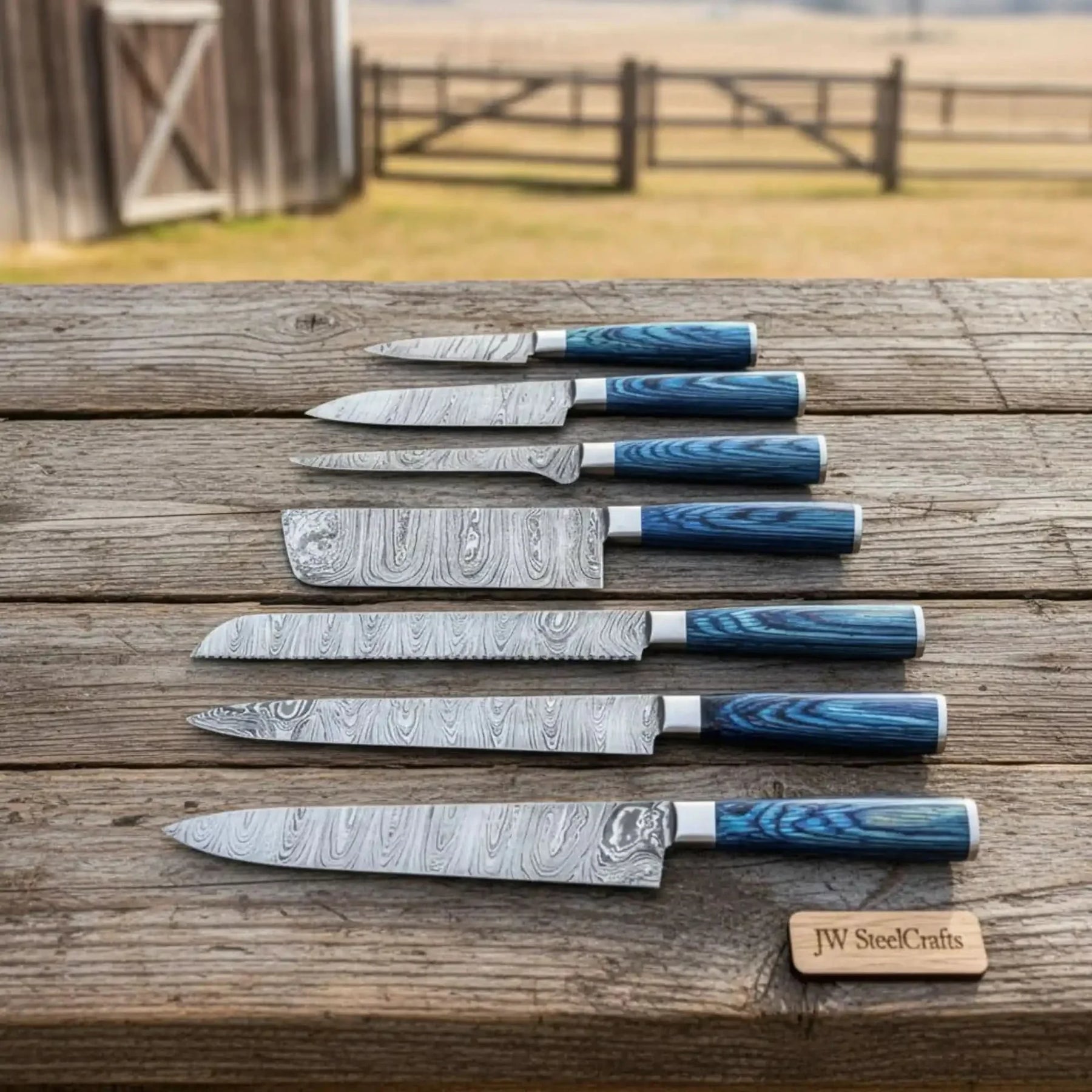 Handmade damascus steel knife with premium handle on dark surface
