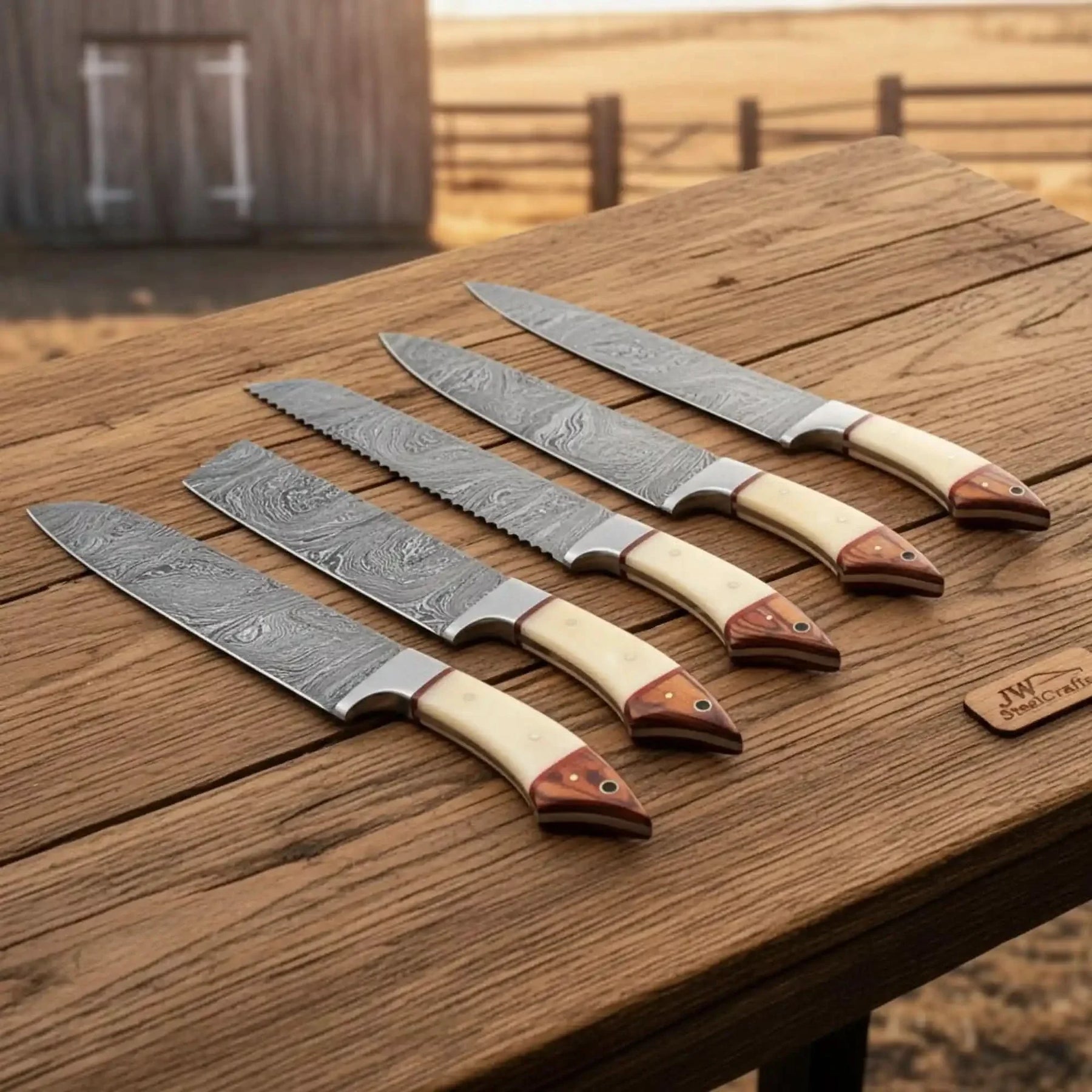 Handmade damascus steel knife with wood handle on dark surface