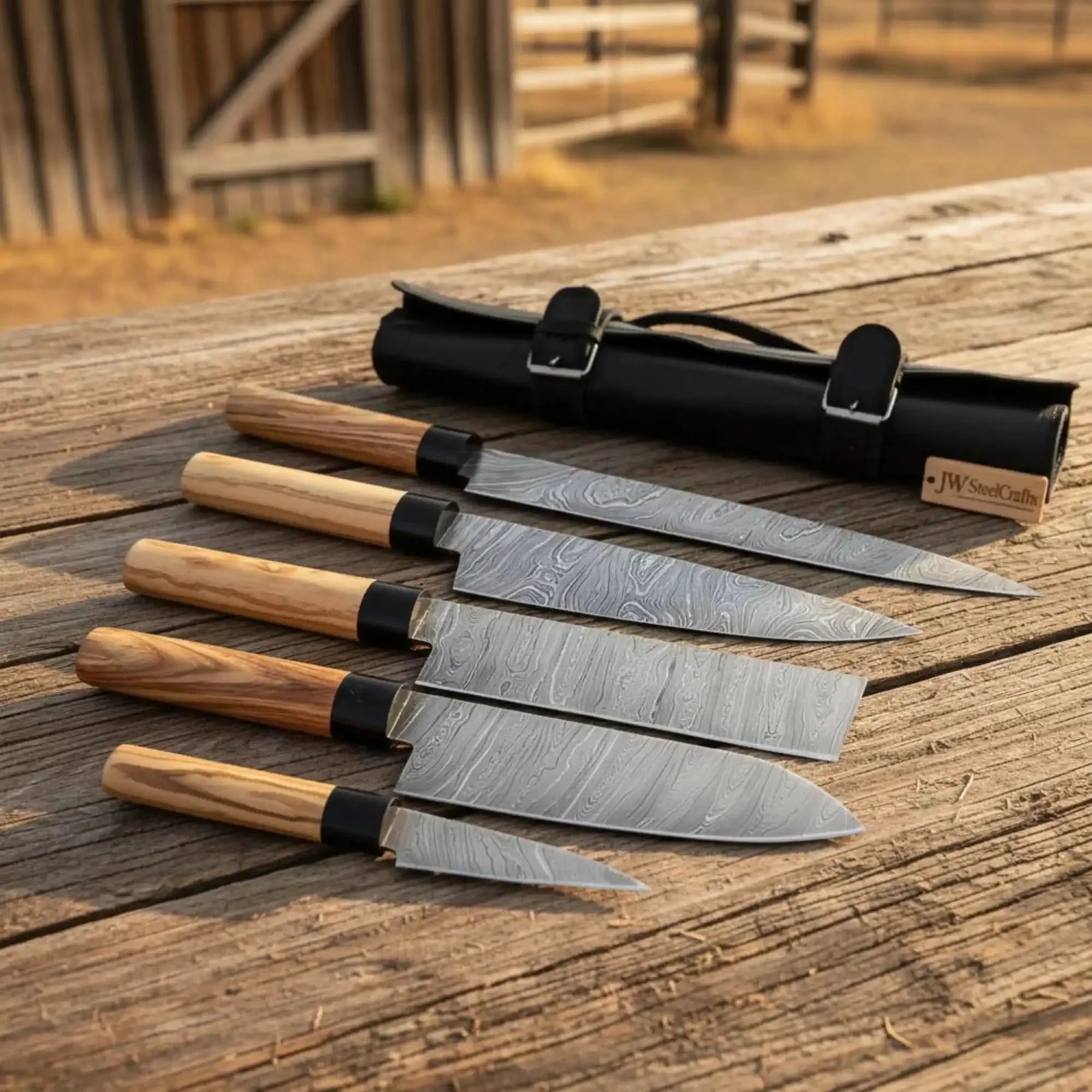 Handmade damascus steel knife with wood handle on dark surface