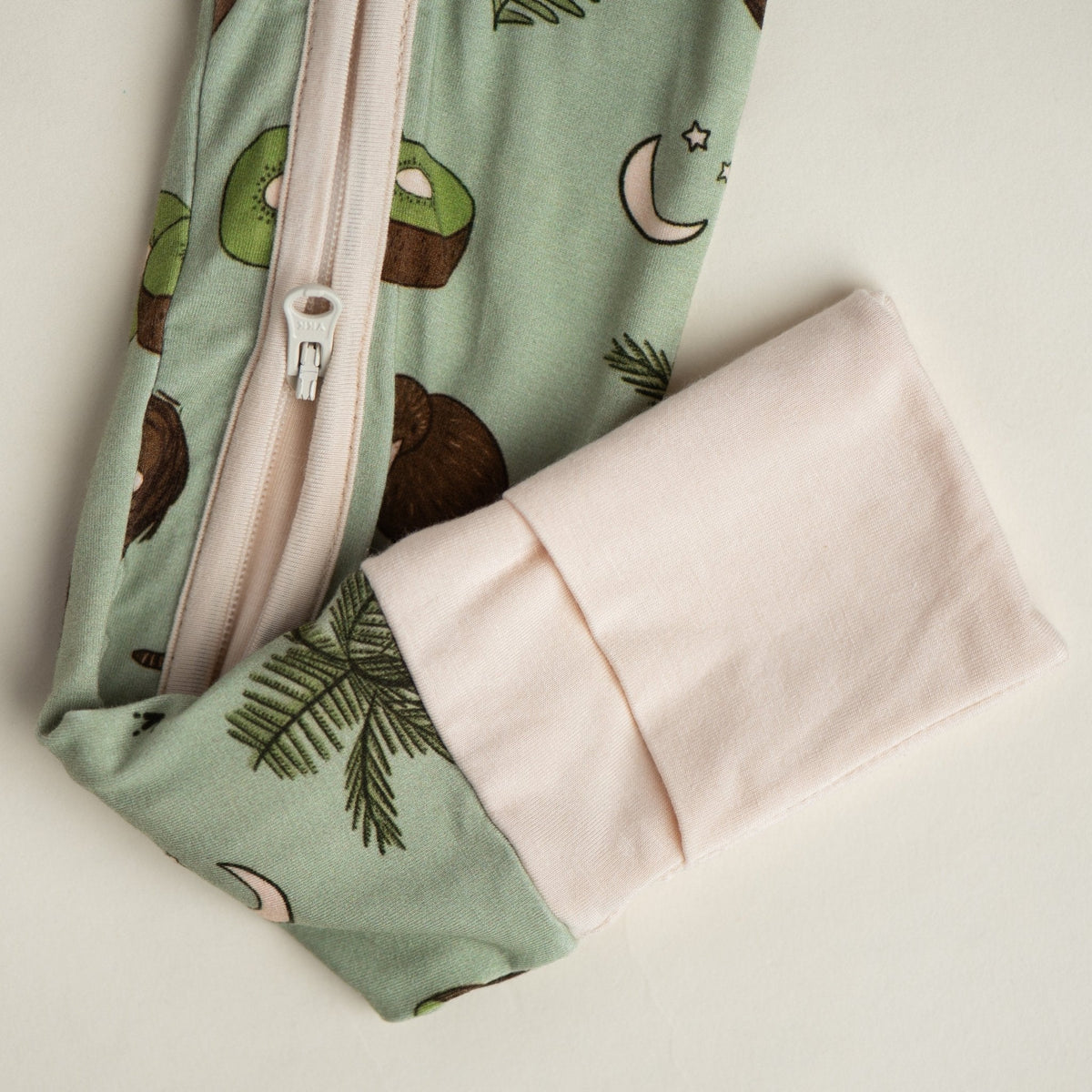Additional view of Kiwi Bird bamboo baby zip pajamas with hand drawn animal print