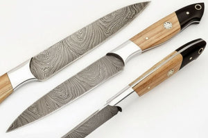 Handmade damascus steel knife with wood handle on dark surface