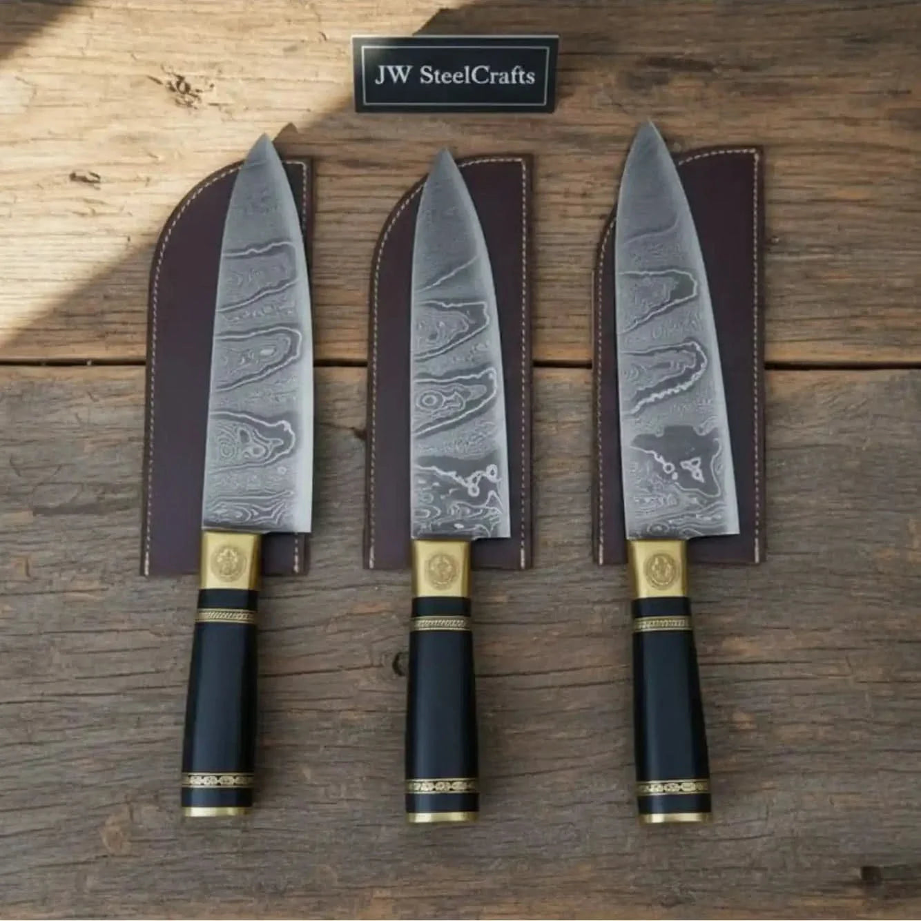 Handmade damascus steel knife with resin handle on dark surface