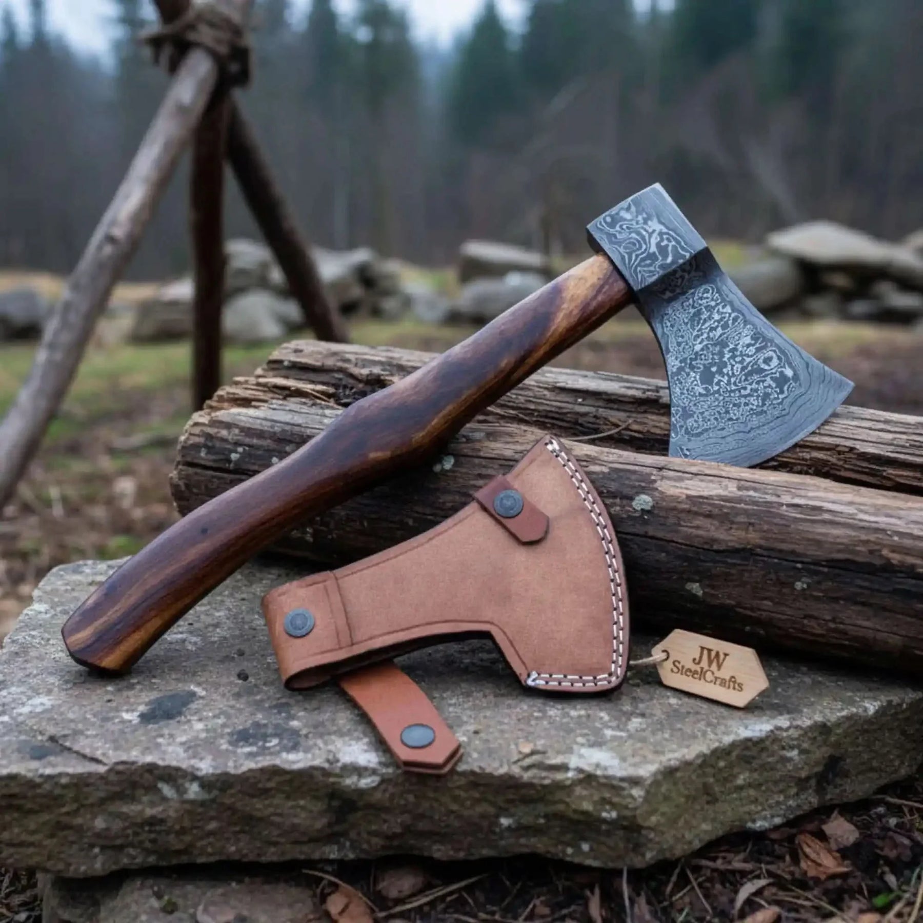 Damascus steel axe head with wood handle on rustic wood surface