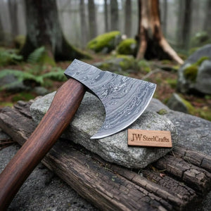 Damascus steel axe head with wood handle on rustic wood surface