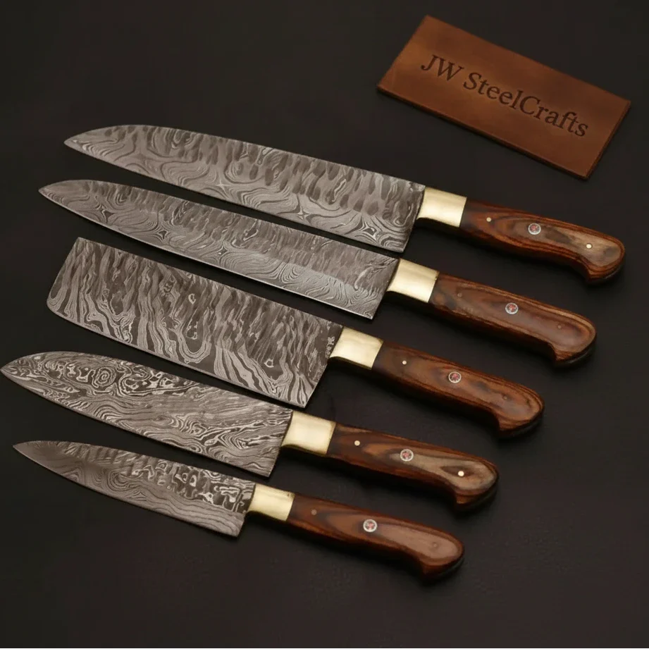 Handmade damascus steel knife with premium handle on dark surface