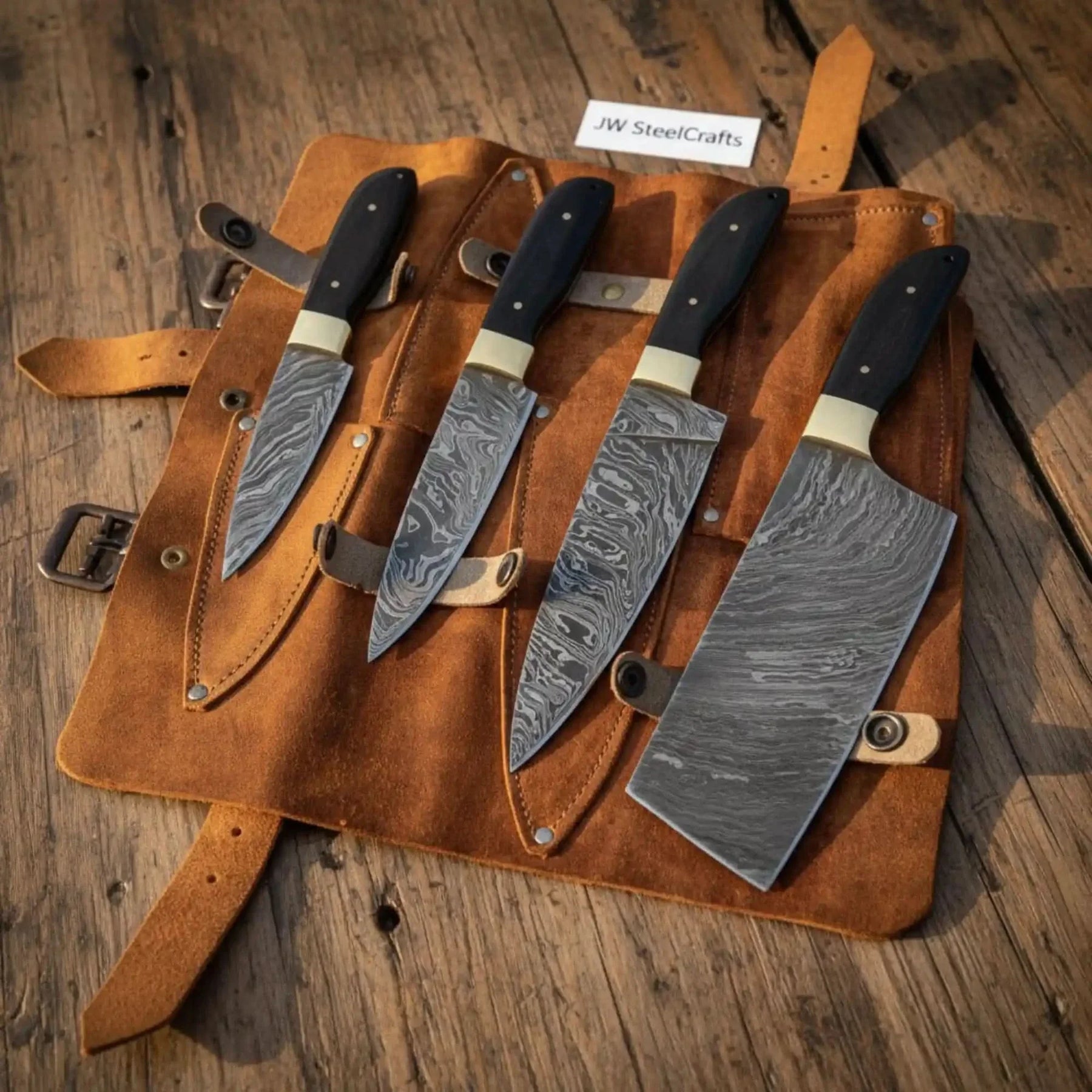 Handmade damascus steel knife with resin handle on dark surface