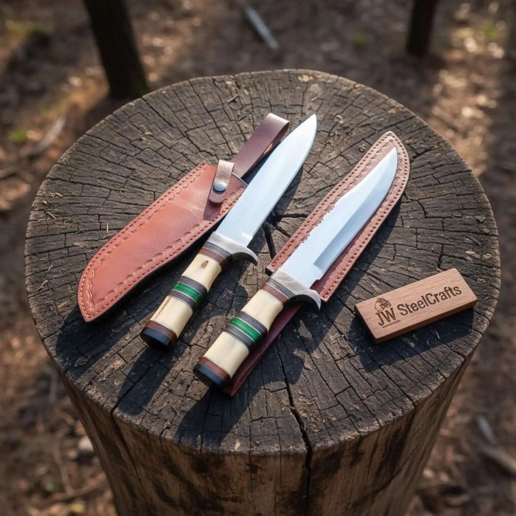 Handmade damascus steel knife with premium handle on dark surface