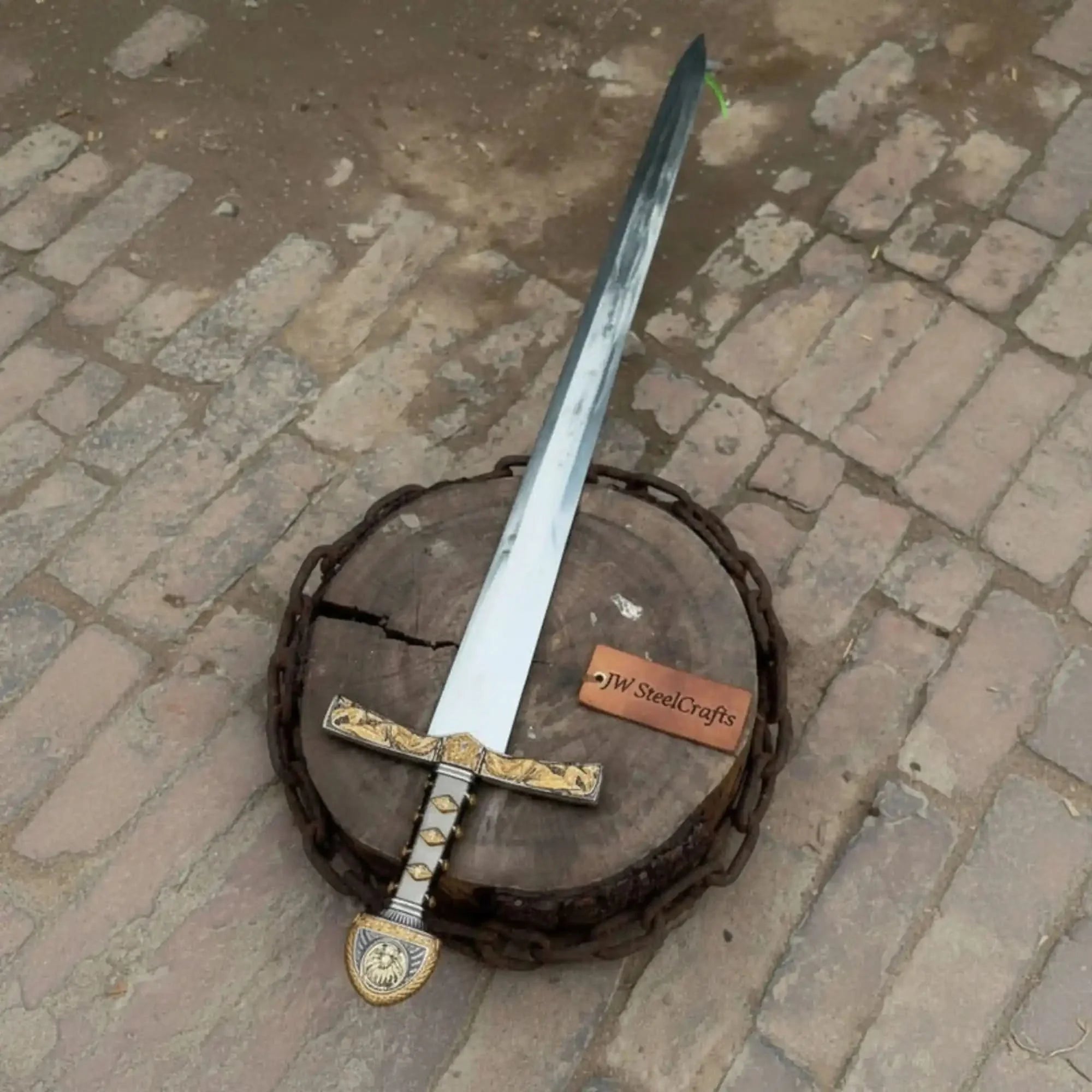Full-length damascus steel replica sword with premium handle on dark background