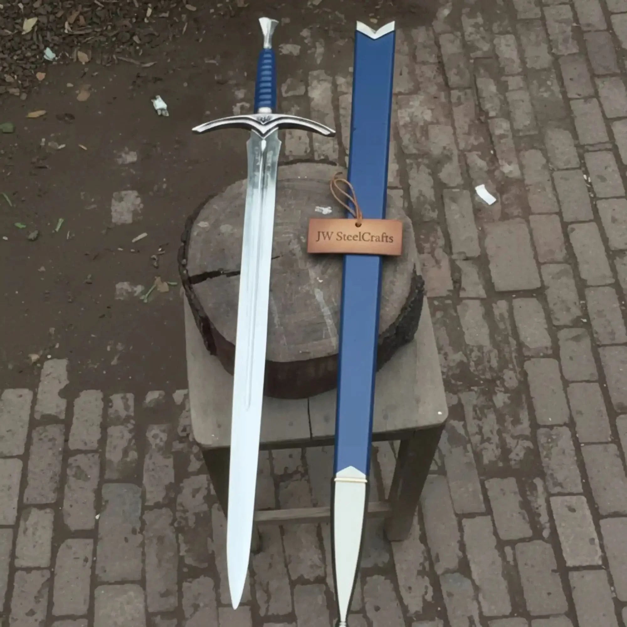 Full-length damascus steel replica sword with leather handle on dark background