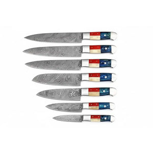Handmade damascus steel knife with premium handle on dark surface