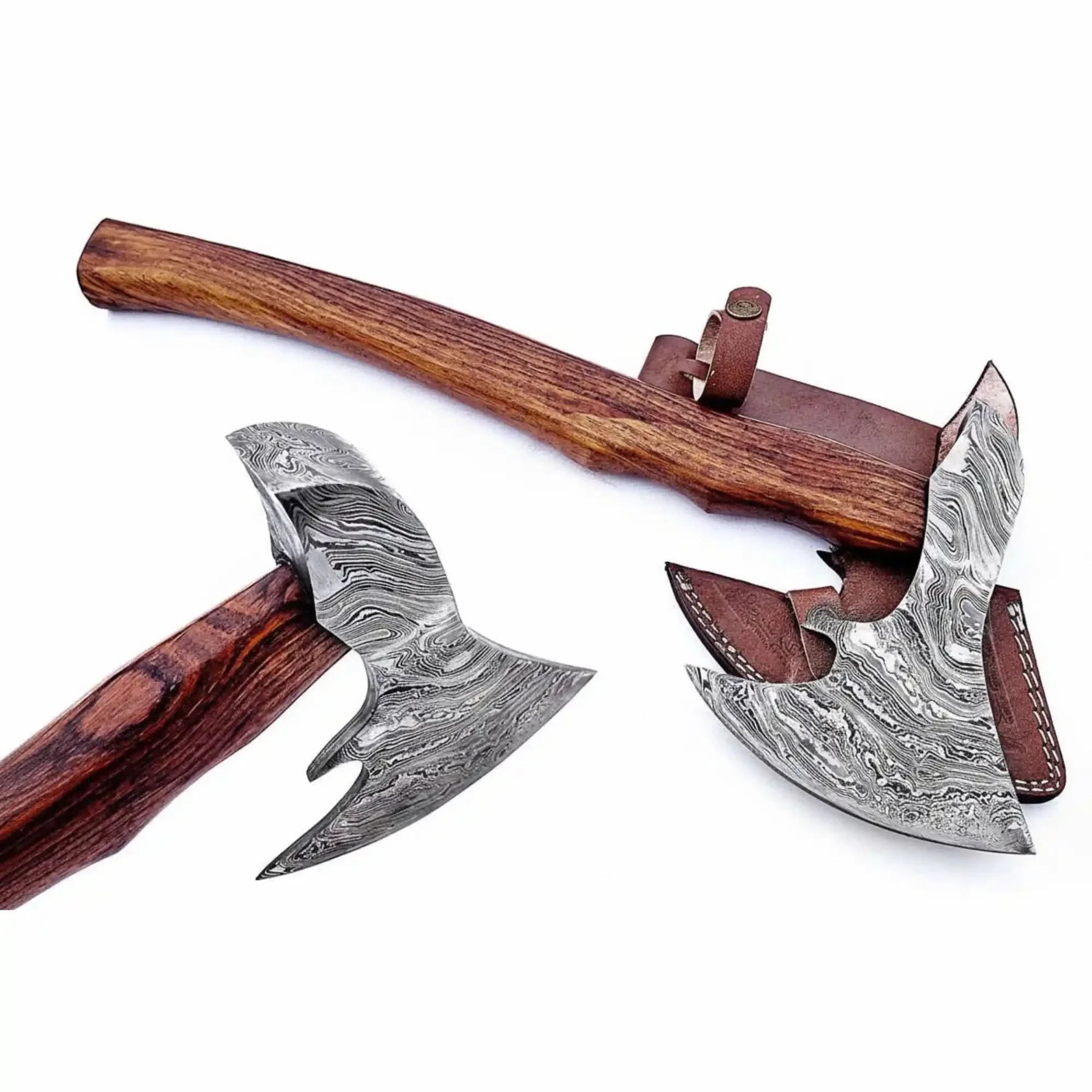 Damascus steel axe head with wood handle on rustic wood surface